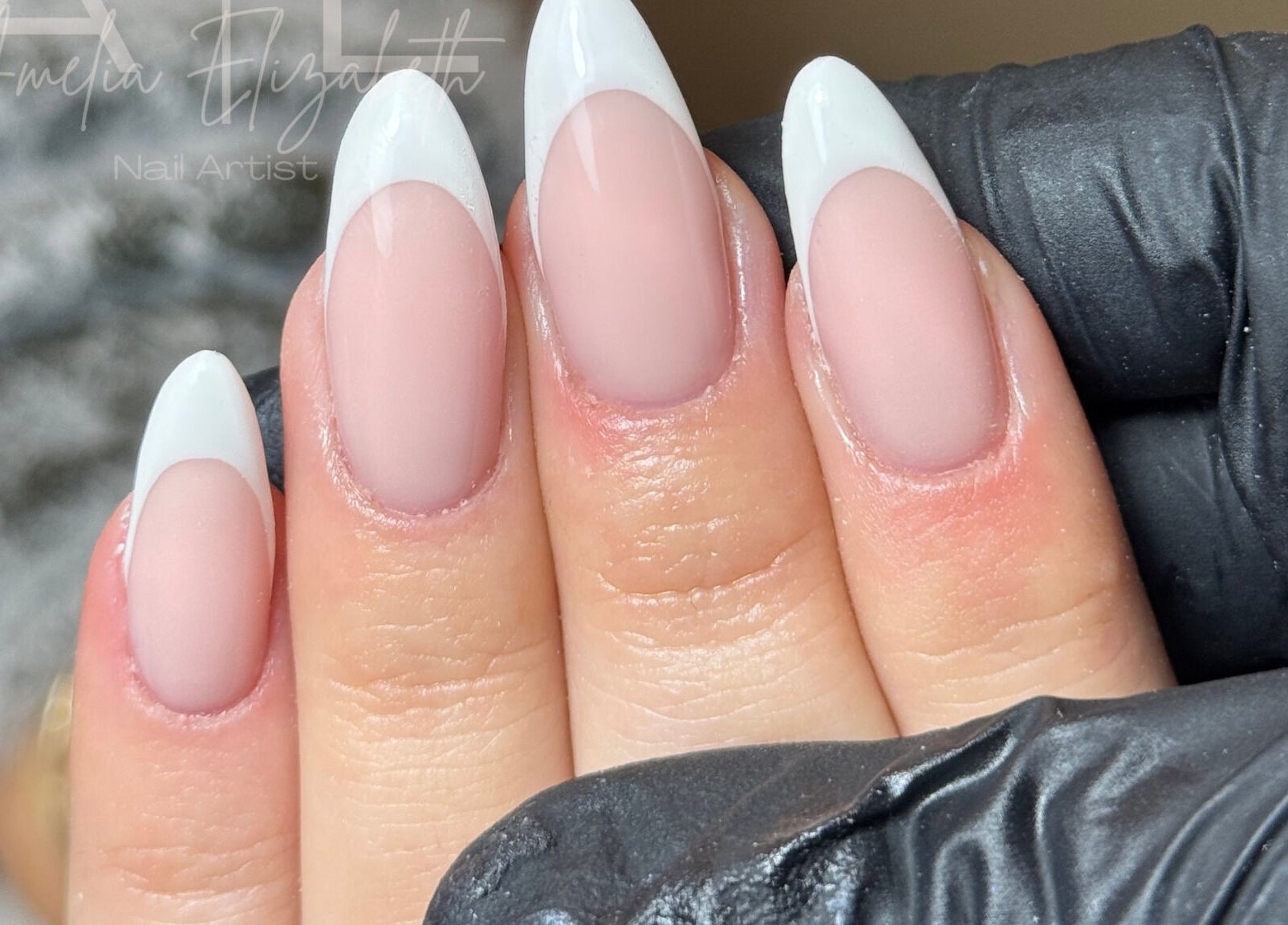 Elegant French tip nails at Ameliaelizabethnails in Stoke-on-Trent, England, GB showcasing skilled design.