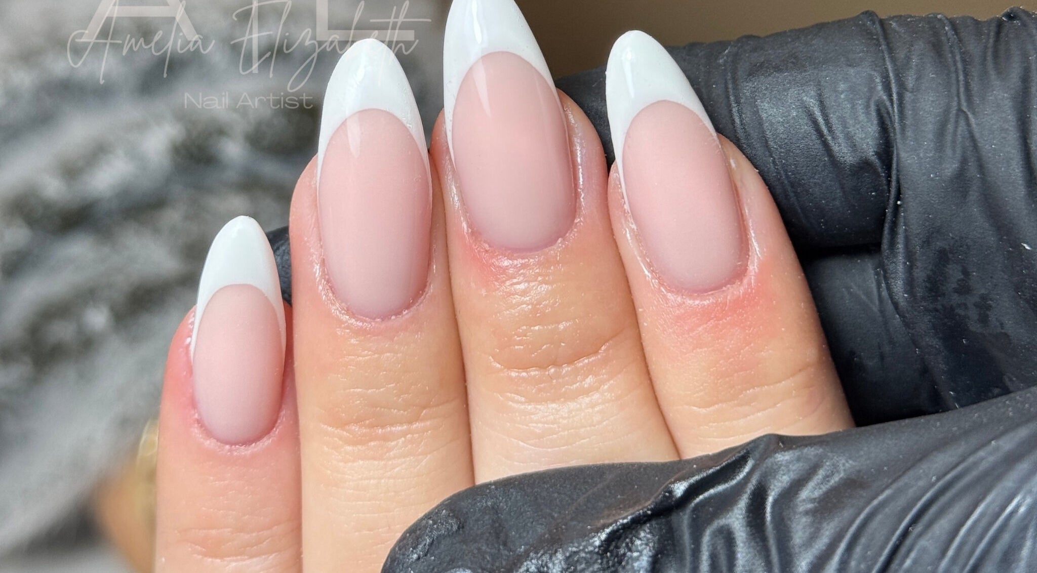 Elegant French tip nails at Ameliaelizabethnails in Stoke-on-Trent, England, GB showcasing skilled design.