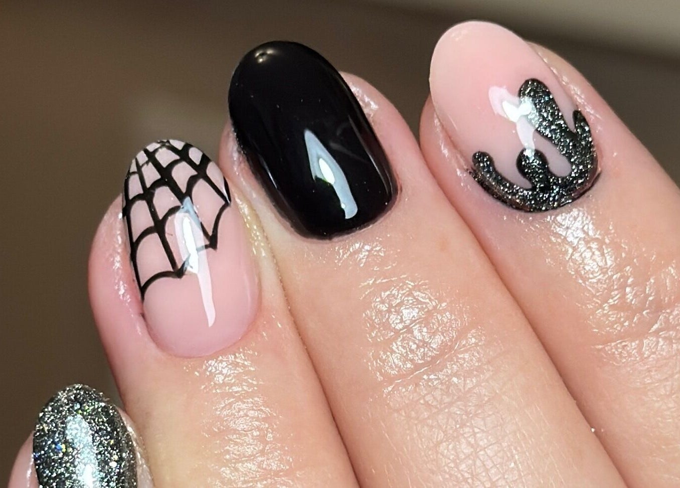 Halloween-themed nail art at Ameliaelizabethnails, Stoke-on-Trent, England, GB featuring web and crown designs.