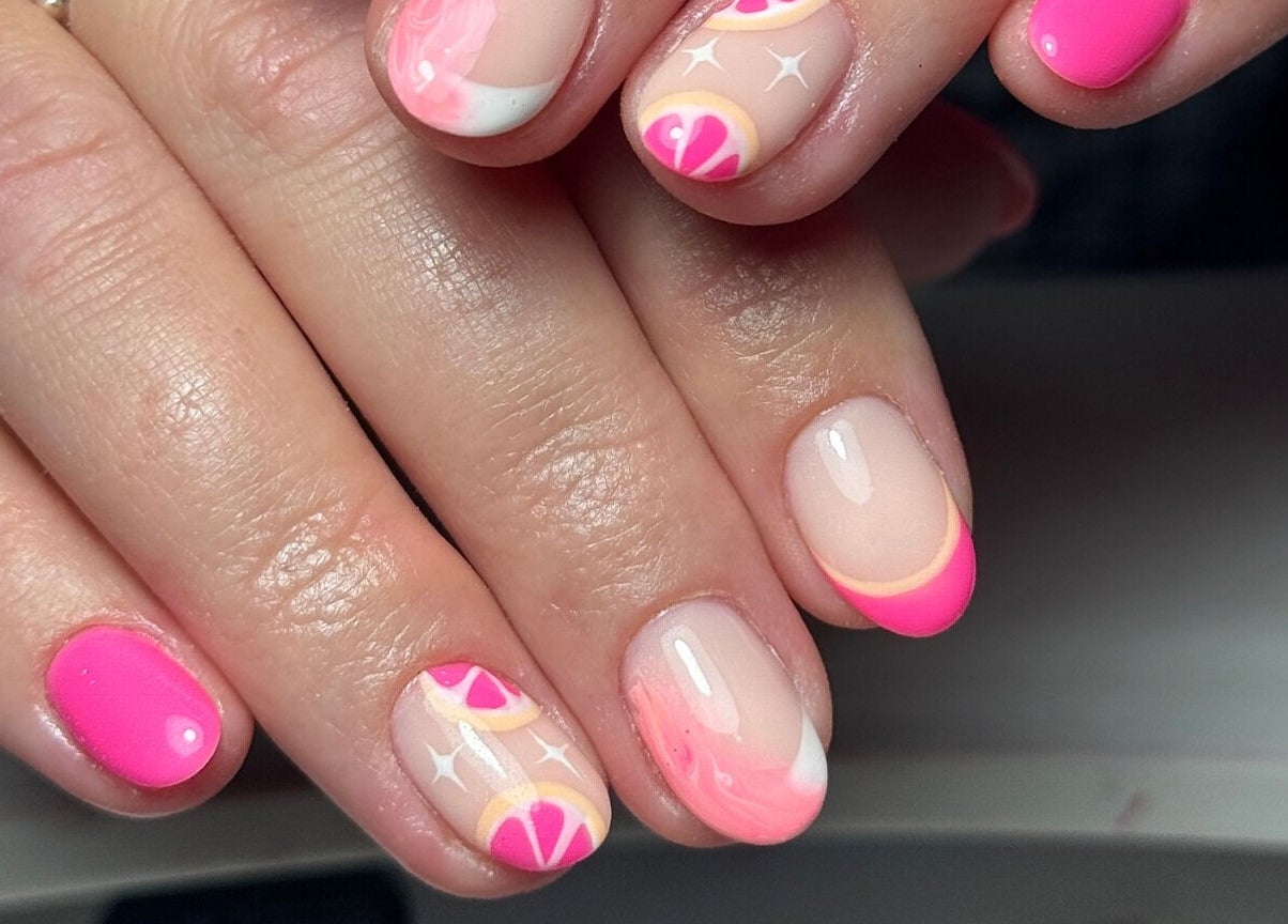 Vibrant neon pink and citrus design nails at Ameliaelizabethnails, Stoke-on-Trent, England, GB.