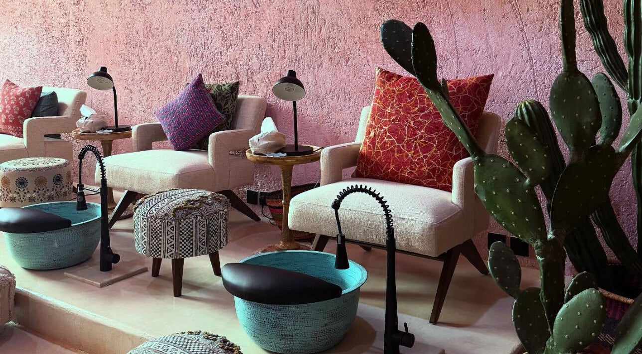 Relaxing pedicure area at Pinkaboo Nail Boutique, Riyadh, Riyadh Province, SA with plush chairs and vibrant decor.