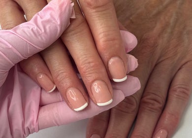 French manicure at Beauty by Billie, Portsmouth, England, GB. Close-up of nail polish on hands.