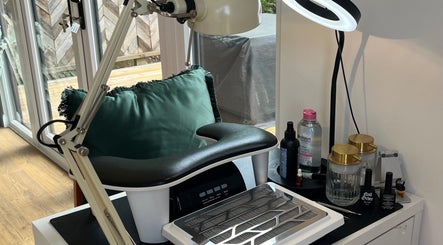 Modern nail station at Nailz with Izzy, Exmouth, England, GB, featuring elegant design and tools.
