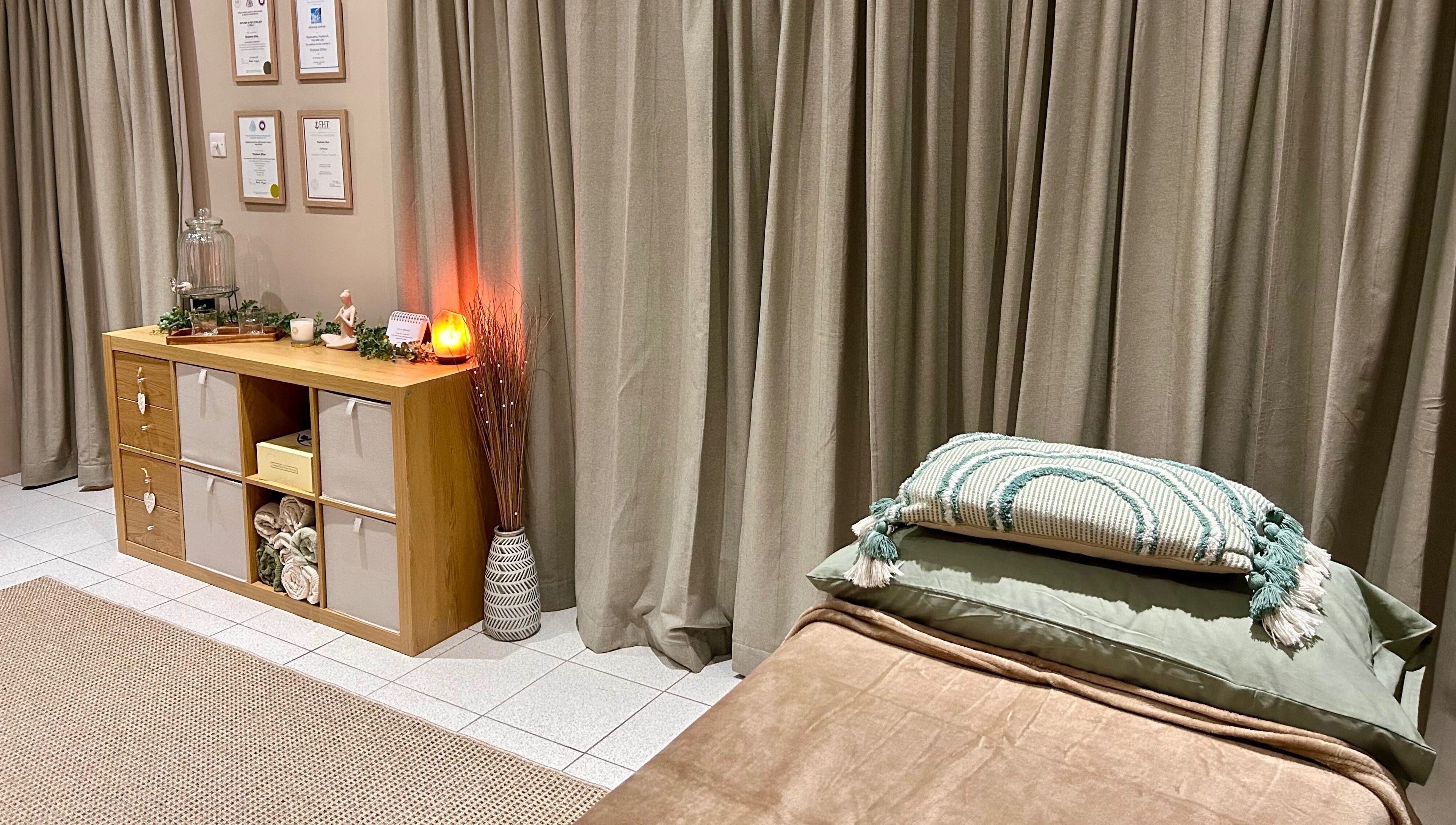 Tranquil massage room at Relax & Bloom, Bangor, Northern Ireland, GB, featuring soft lighting and elegant decor.