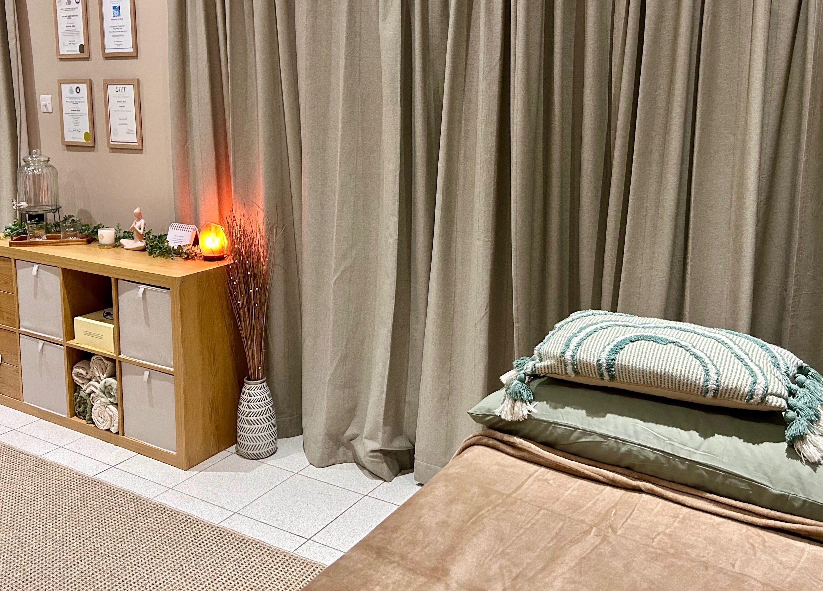 Tranquil massage room at Relax & Bloom, Bangor, Northern Ireland, GB, featuring soft lighting and elegant decor.