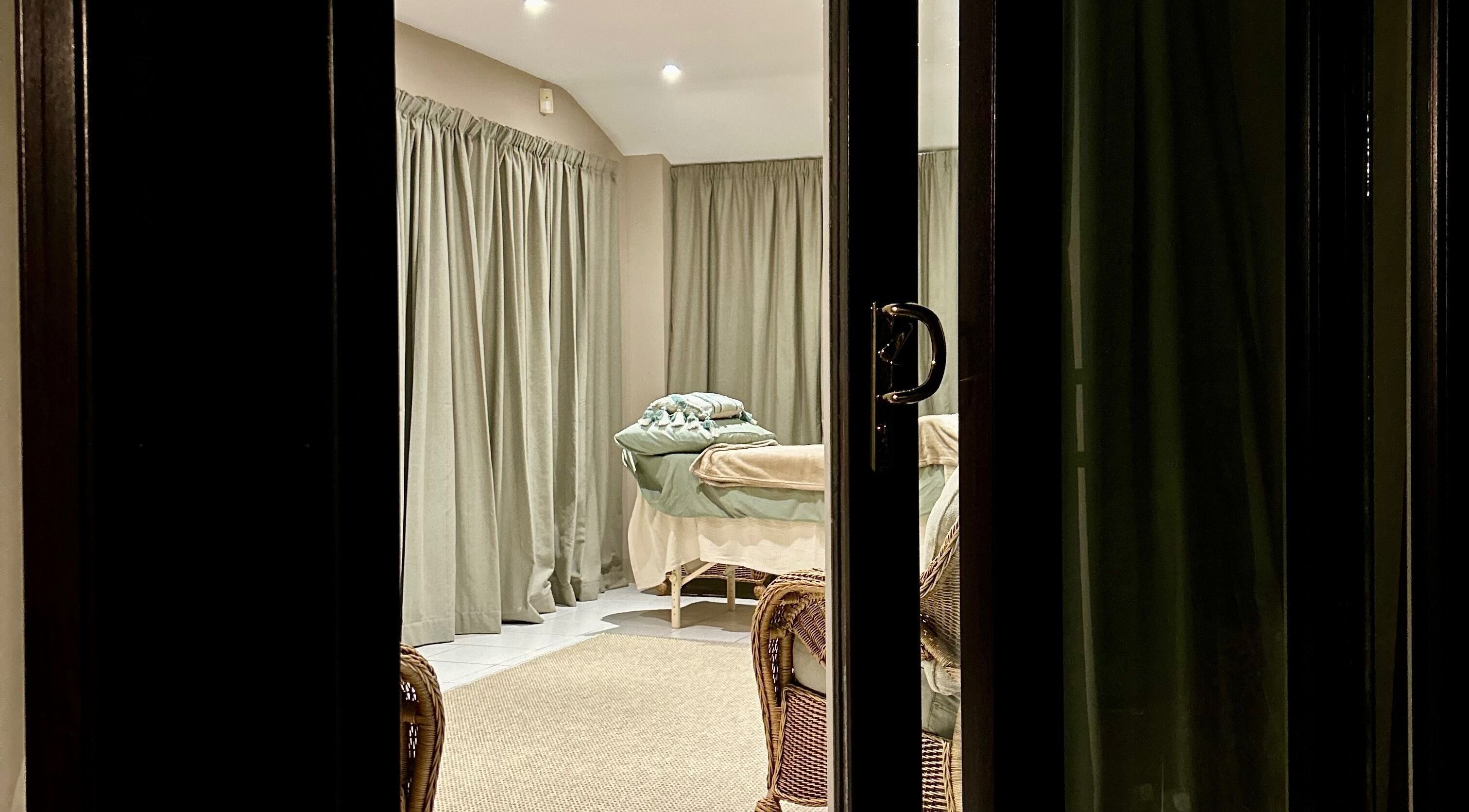 Elegant massage room at Relax & Bloom, Bangor, Northern Ireland, GB with soothing decor and gentle lighting.