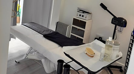 Massage room at Above & Beyond Beauty & Massage, Sutton-in-Ashfield, England, GB. Features treatment table and spa essentials.