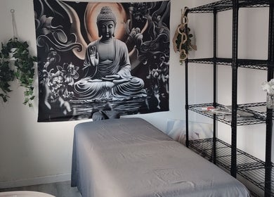 Calming massage room at Above & Beyond Beauty & Massage, Sutton-in-Ashfield, England, GB, with Buddha decor.