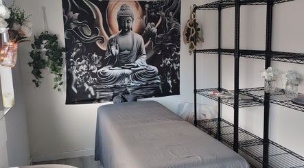Calming massage room at Above & Beyond Beauty & Massage, Sutton-in-Ashfield, England, GB, with Buddha decor.