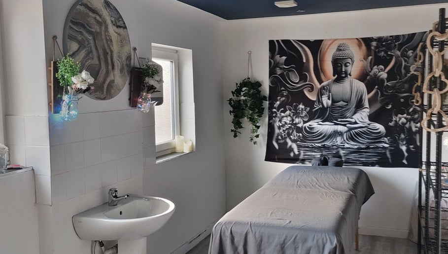 Tranquil spa room at Above & Beyond Beauty & Massage in Sutton-in-Ashfield, England, GB with Buddha decor.