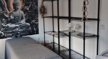 Relaxation room with Buddha decor at Above & Beyond Beauty & Massage, Sutton-in-Ashfield, England, GB.