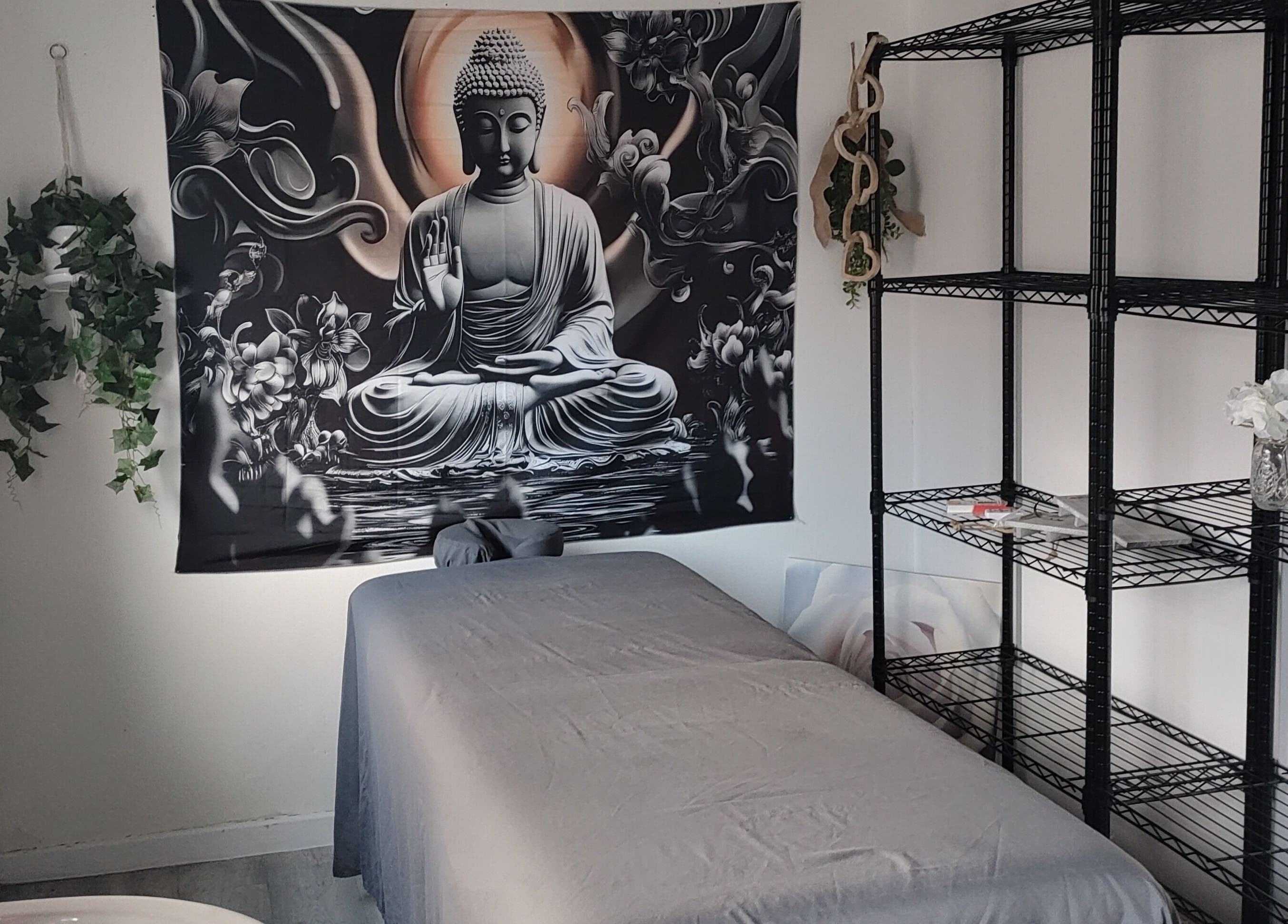 Calming massage room at Above & Beyond Beauty & Massage in Sutton-in-Ashfield, England, GB with Buddha art.