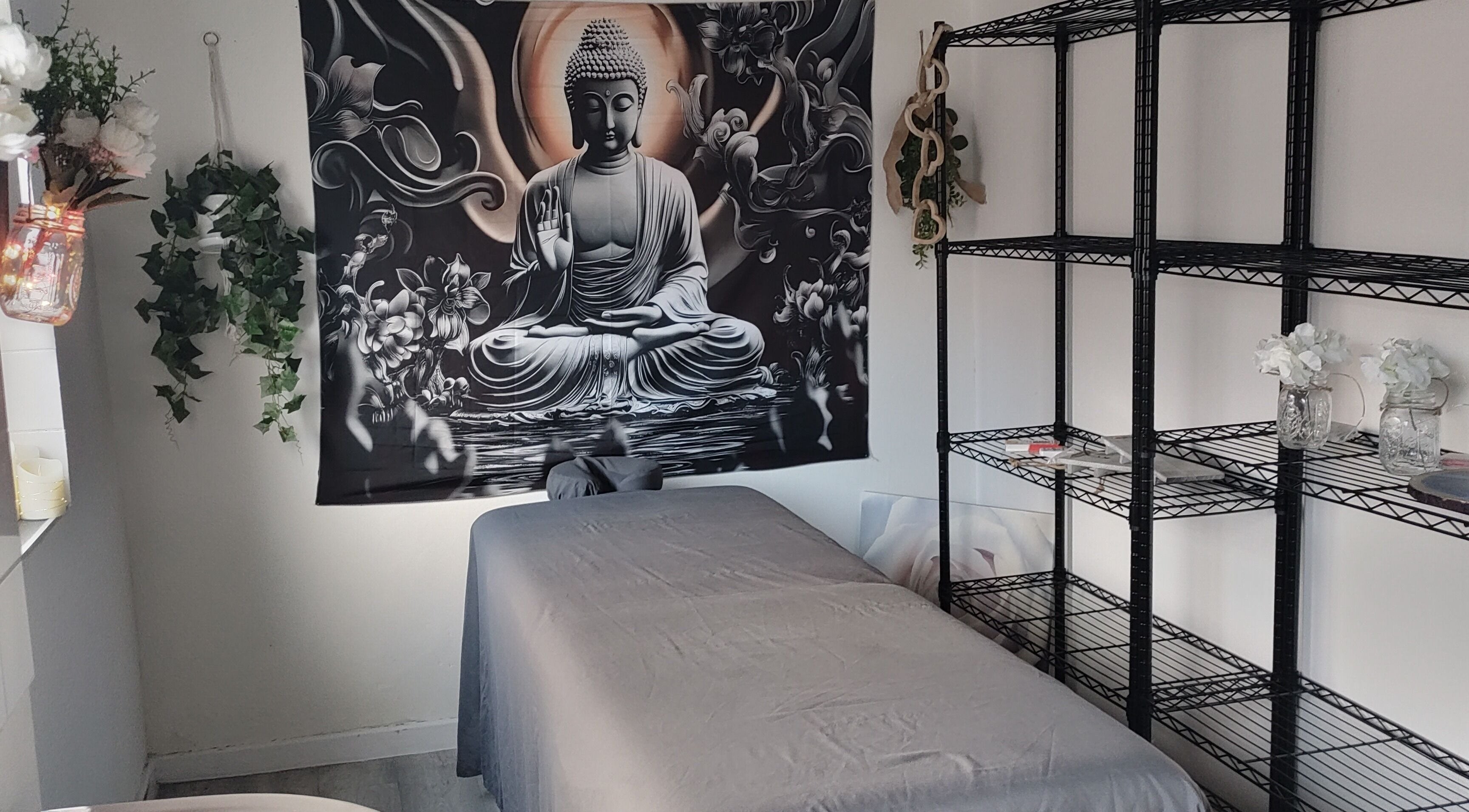 Calming massage room at Above & Beyond Beauty & Massage in Sutton-in-Ashfield, England, GB with Buddha art.