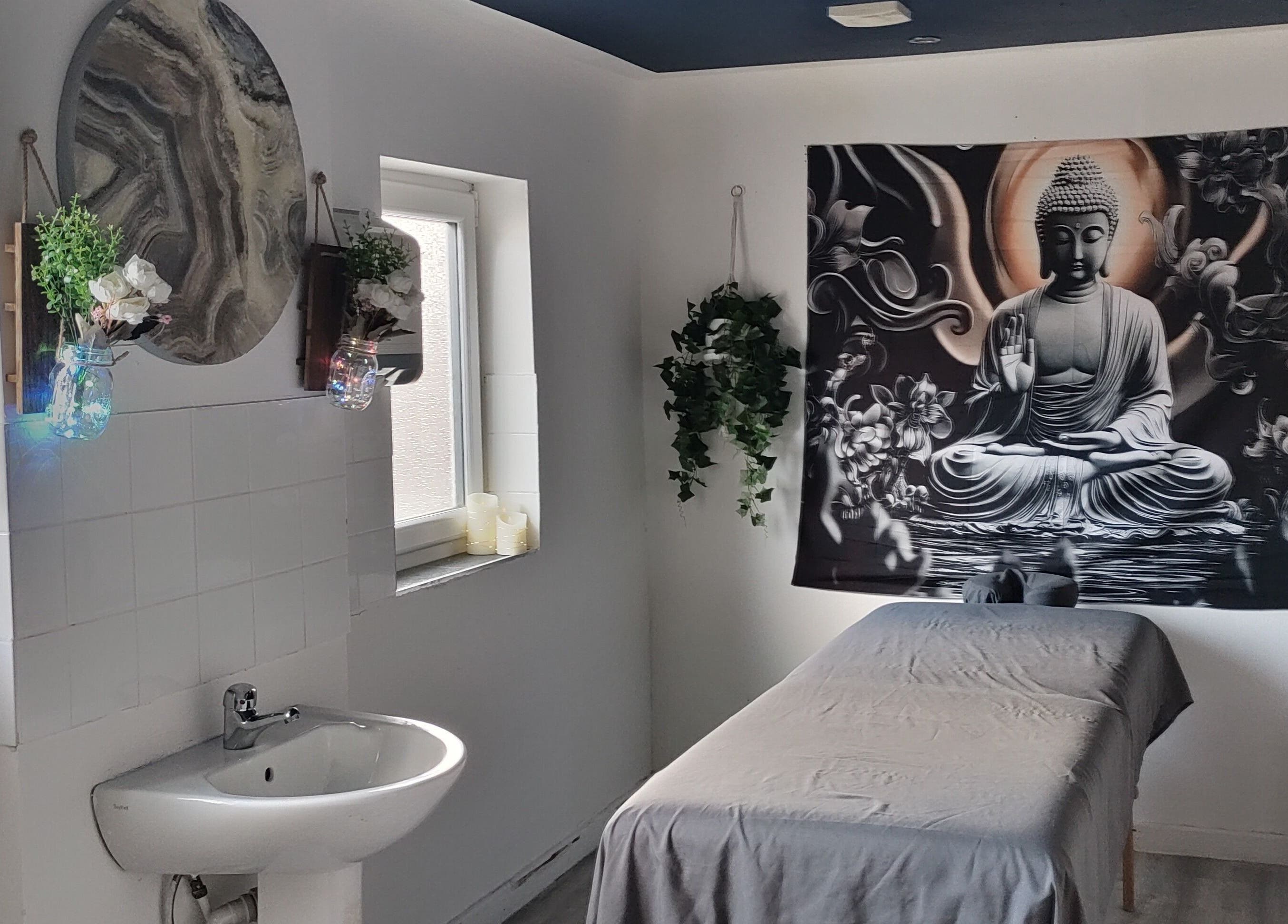 Calming massage room at Above & Beyond Beauty & Massage, Sutton-in-Ashfield, England, GB with Buddha decor.