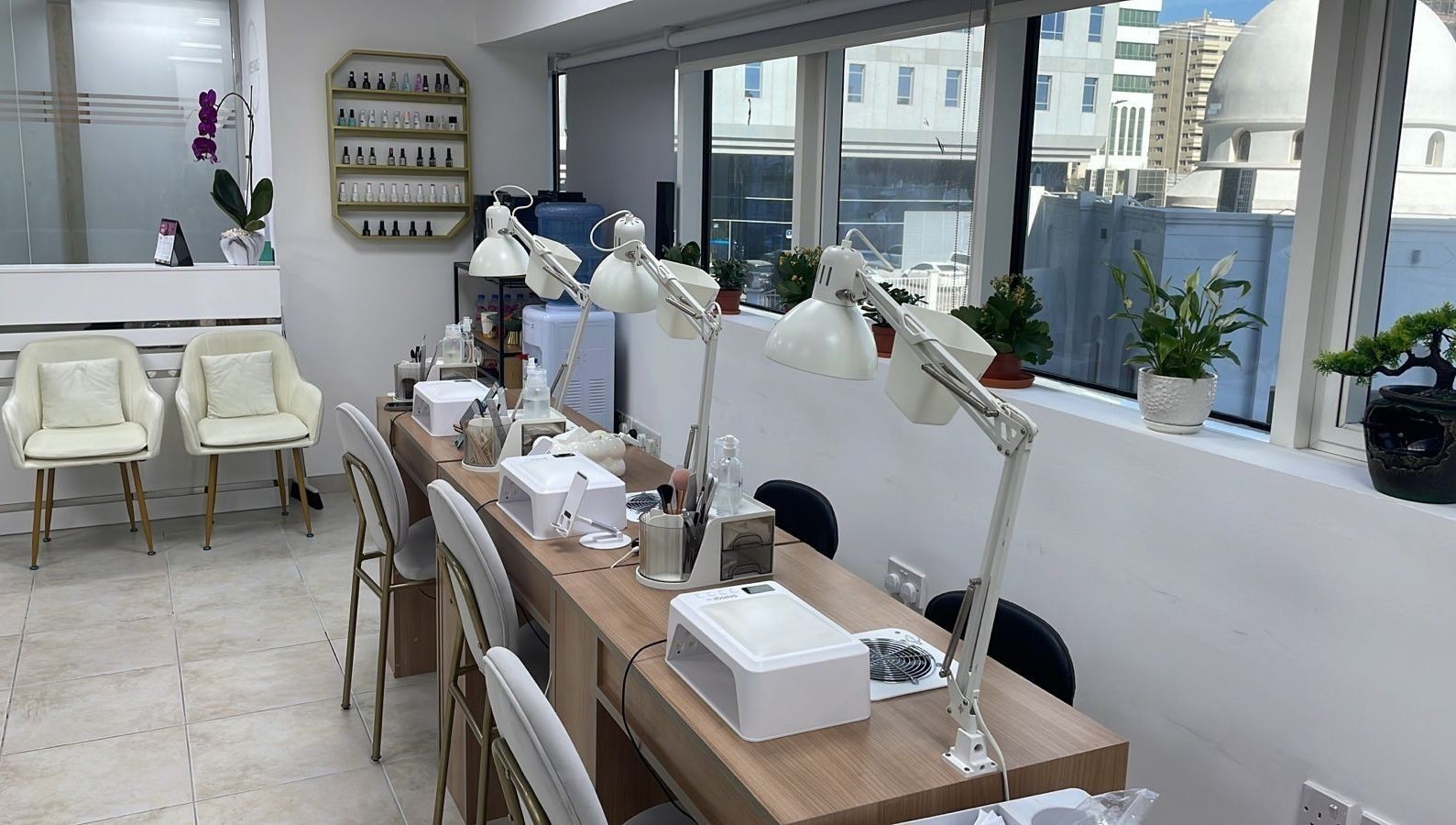 Bright interior of Hype Nails Beauty Salon, Abu Dhabi, AE, showcasing nail stations with elegant decor.