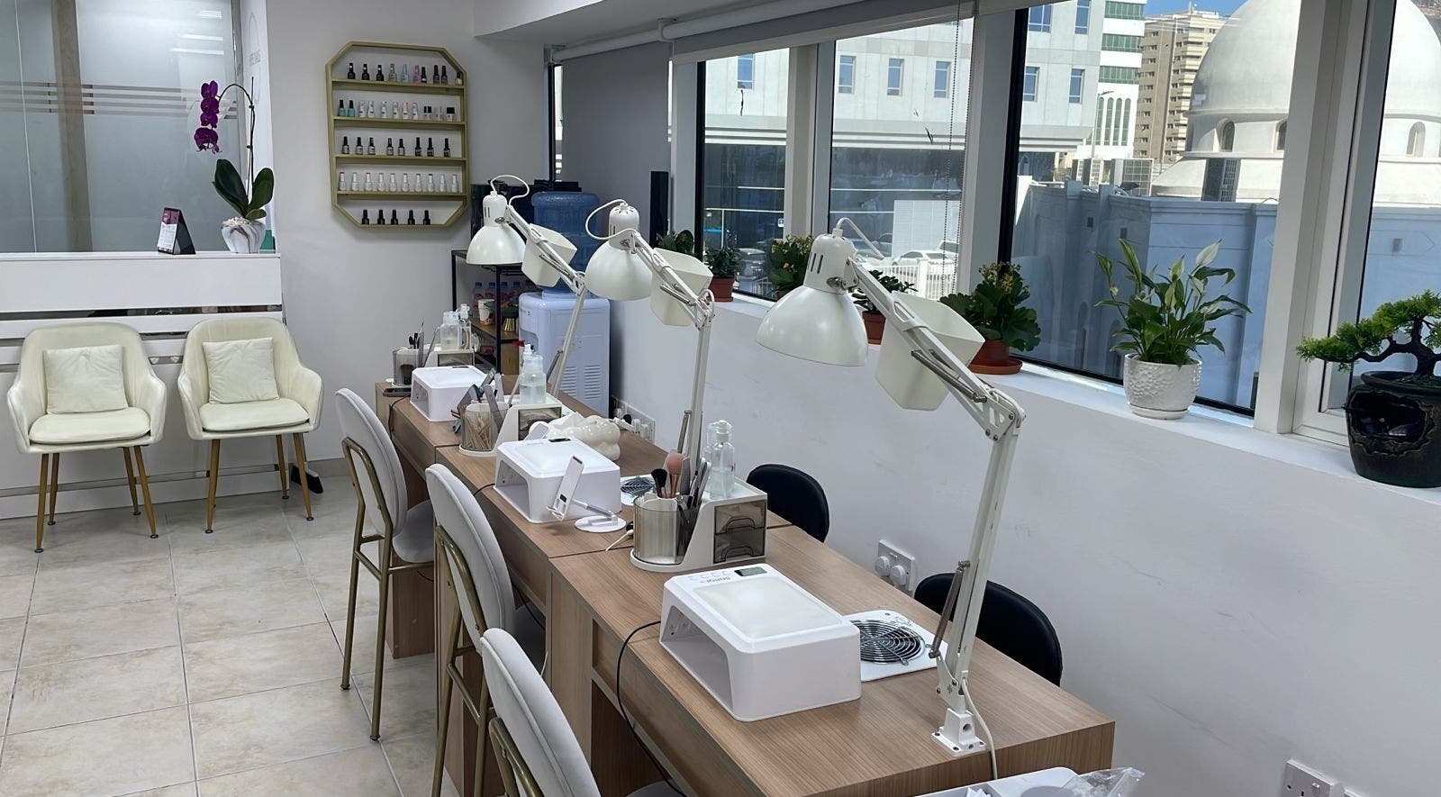 Bright interior of Hype Nails Beauty Salon, Abu Dhabi, AE, showcasing nail stations with elegant decor.