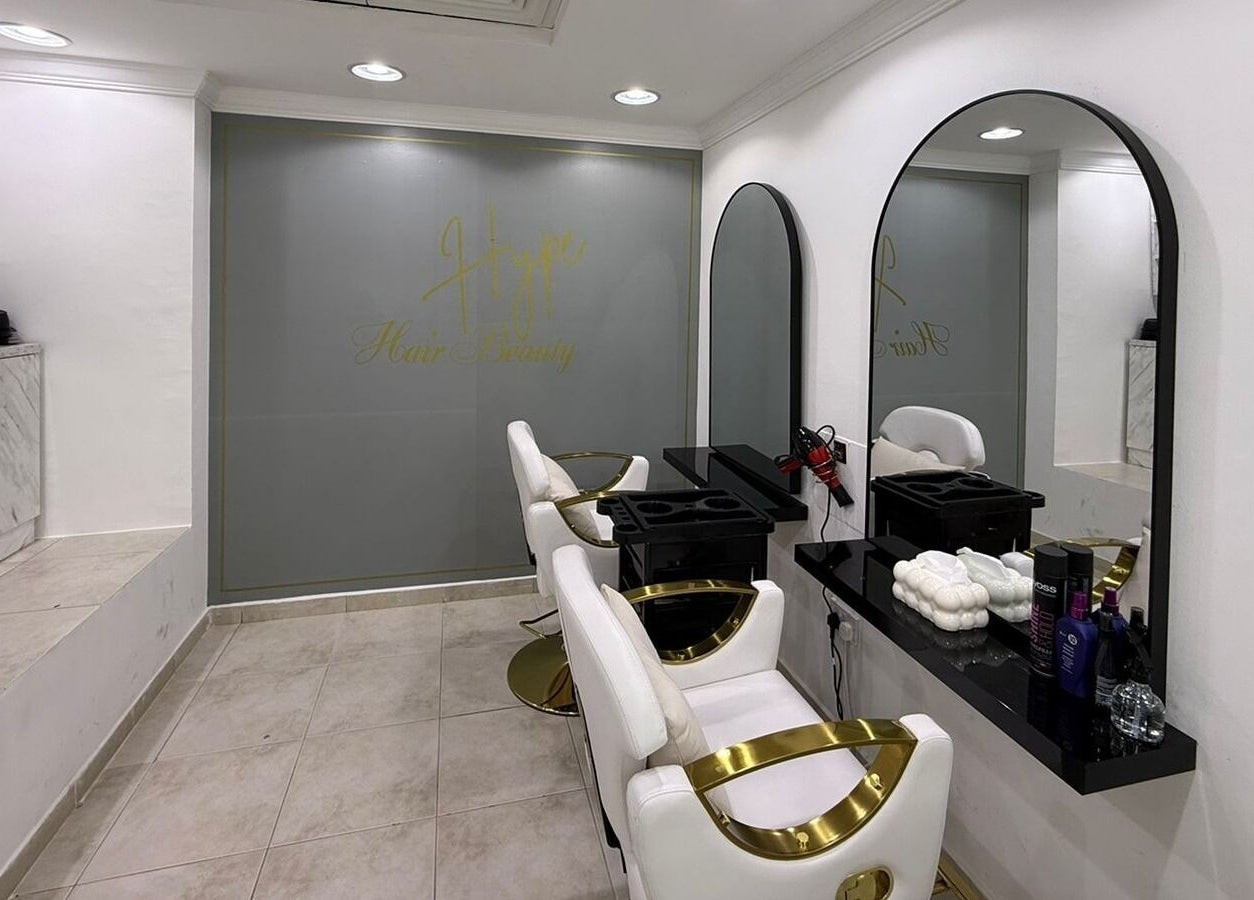 Modern minimalist interior of Hype Nails Beauty Salon in Abu Dhabi, Abu Dhabi, AE, featuring sleek salon chairs.