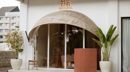 Elegant entrance of Luna massage bali - Pererenan, Bali, ID, featuring potted plants and a welcoming awning.