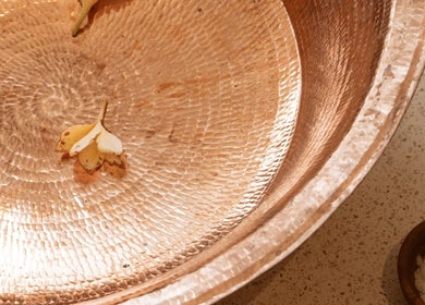 Intricate copper bowl with petals at Luna massage bali - Pererenan, Bali, Bali, ID, showcasing spa tranquility.