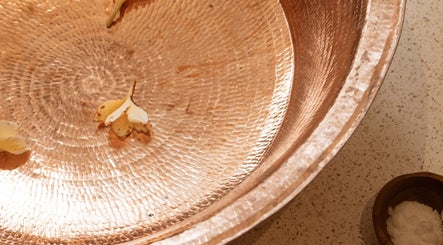 Intricate copper bowl with petals at Luna massage bali - Pererenan, Bali, Bali, ID, showcasing spa tranquility.