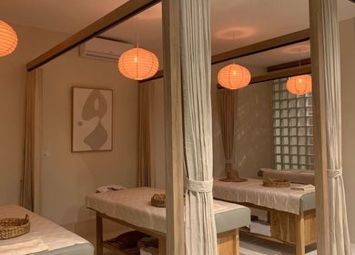 Relaxing massage room at Luna Massage Seseh, Bali, Bali, ID with ambient lighting and plush massage tables.