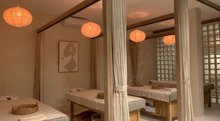 Relaxing massage room at Luna Massage Seseh, Bali, Bali, ID with ambient lighting and plush massage tables.