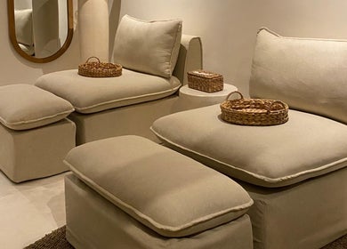 Plush seating area at Luna Massage Seseh, Bali, Bali, ID, featuring cozy beige cushions and woven baskets.