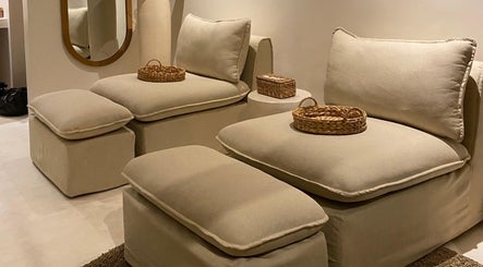 Plush seating area at Luna Massage Seseh, Bali, Bali, ID, featuring cozy beige cushions and woven baskets.