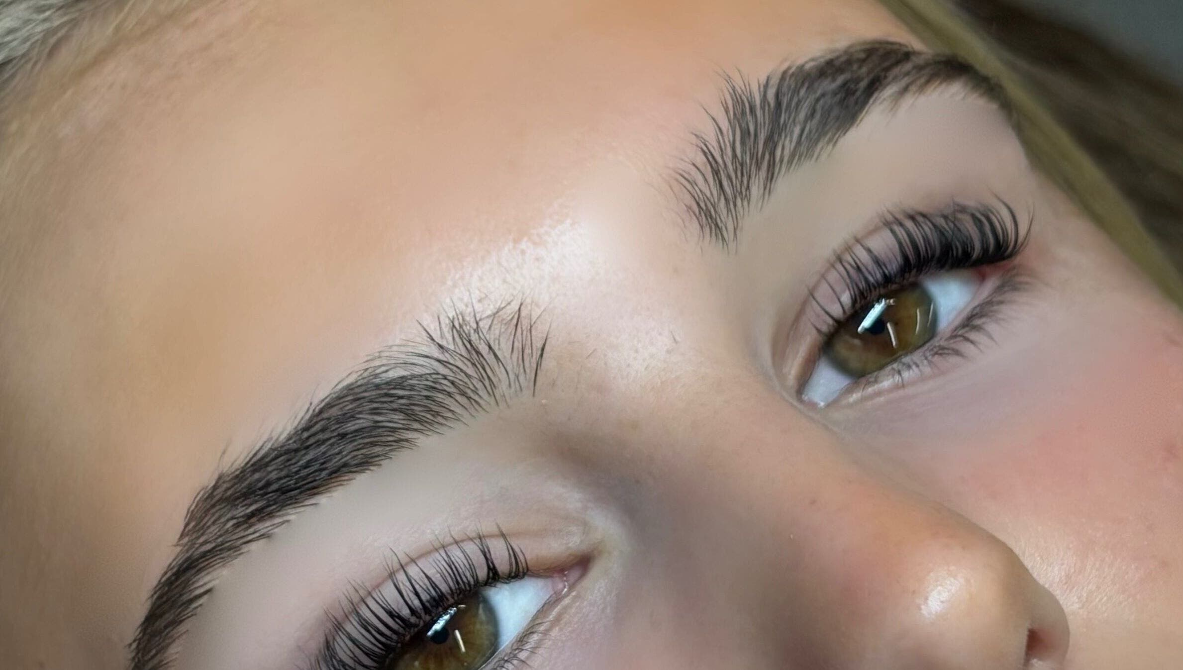 Close-up of perfectly shaped eyebrows at Bourne2lash in Brynhyfryd, Wales, GB.