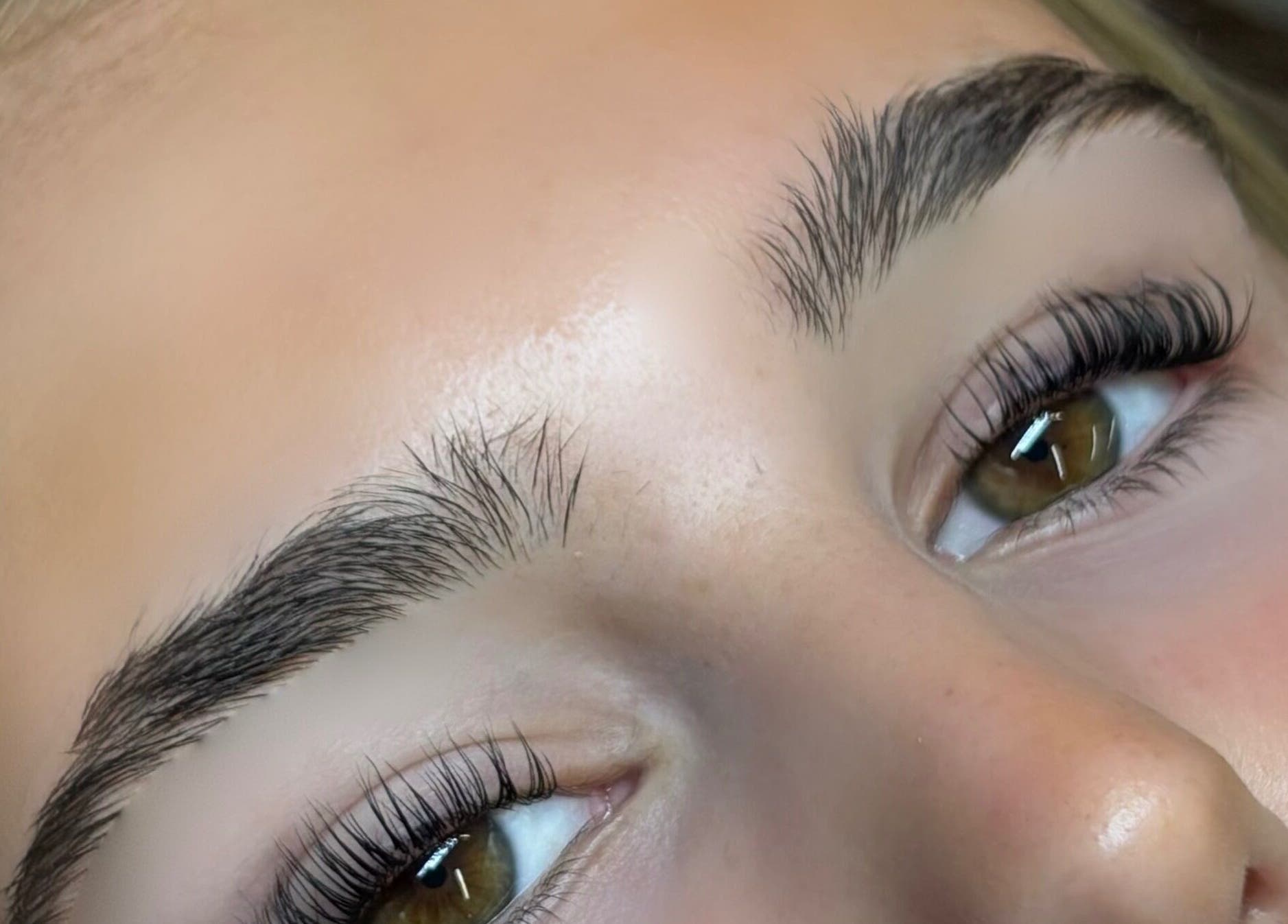 Close-up of perfectly shaped eyebrows at Bourne2lash in Brynhyfryd, Wales, GB.