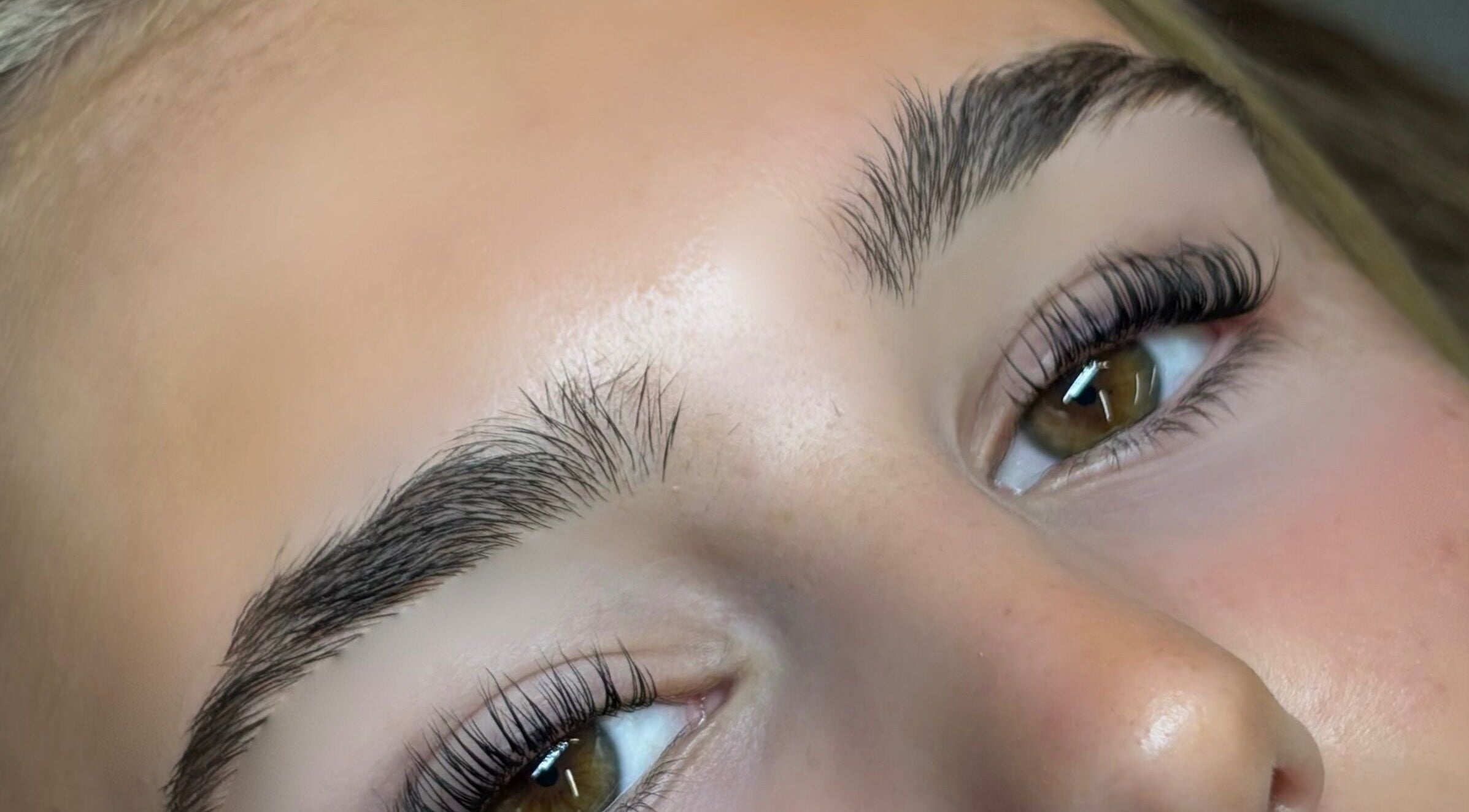 Close-up of perfectly shaped eyebrows at Bourne2lash in Brynhyfryd, Wales, GB.