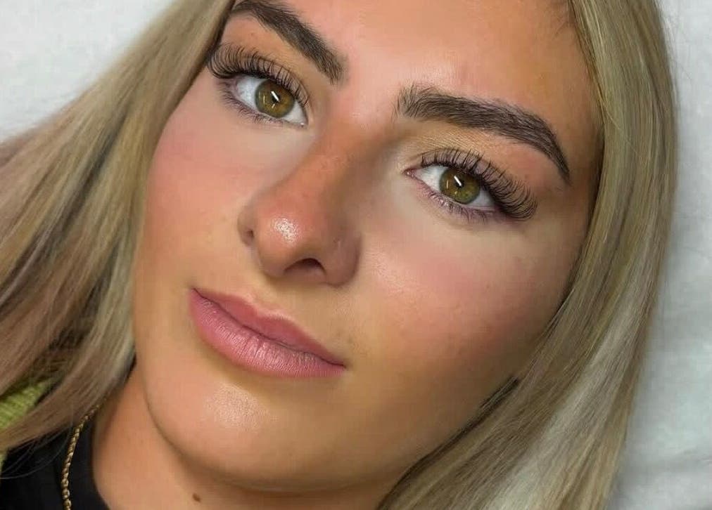 Client with beautifully enhanced lashes at Bourne2lash, Brynhyfryd, Wales, GB. Showcasing expert beauty services.