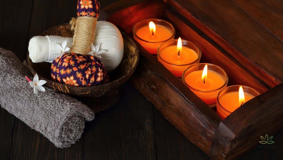 Relaxing spa ambiance at Vedhavillage Spa Trivandrum, Kulathoor, Kerala, IN with candles and herbal balms.
