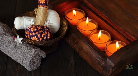 Relaxing spa ambiance at Vedhavillage Spa Trivandrum, Kulathoor, Kerala, IN with candles and herbal balms.