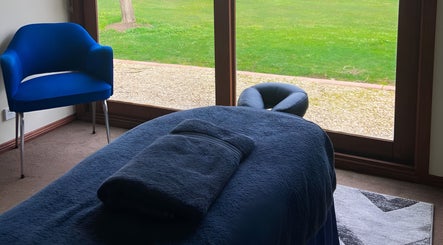 Cozy massage room with window view at Body Tunes Remedial Massage, Lancefield, Victoria, AU.