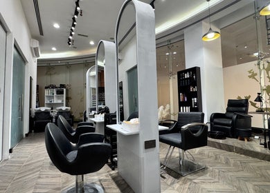 Elegant interior of N - Studio Beauty Lounge in Dubai, AE, featuring stylish seating and modern decor.