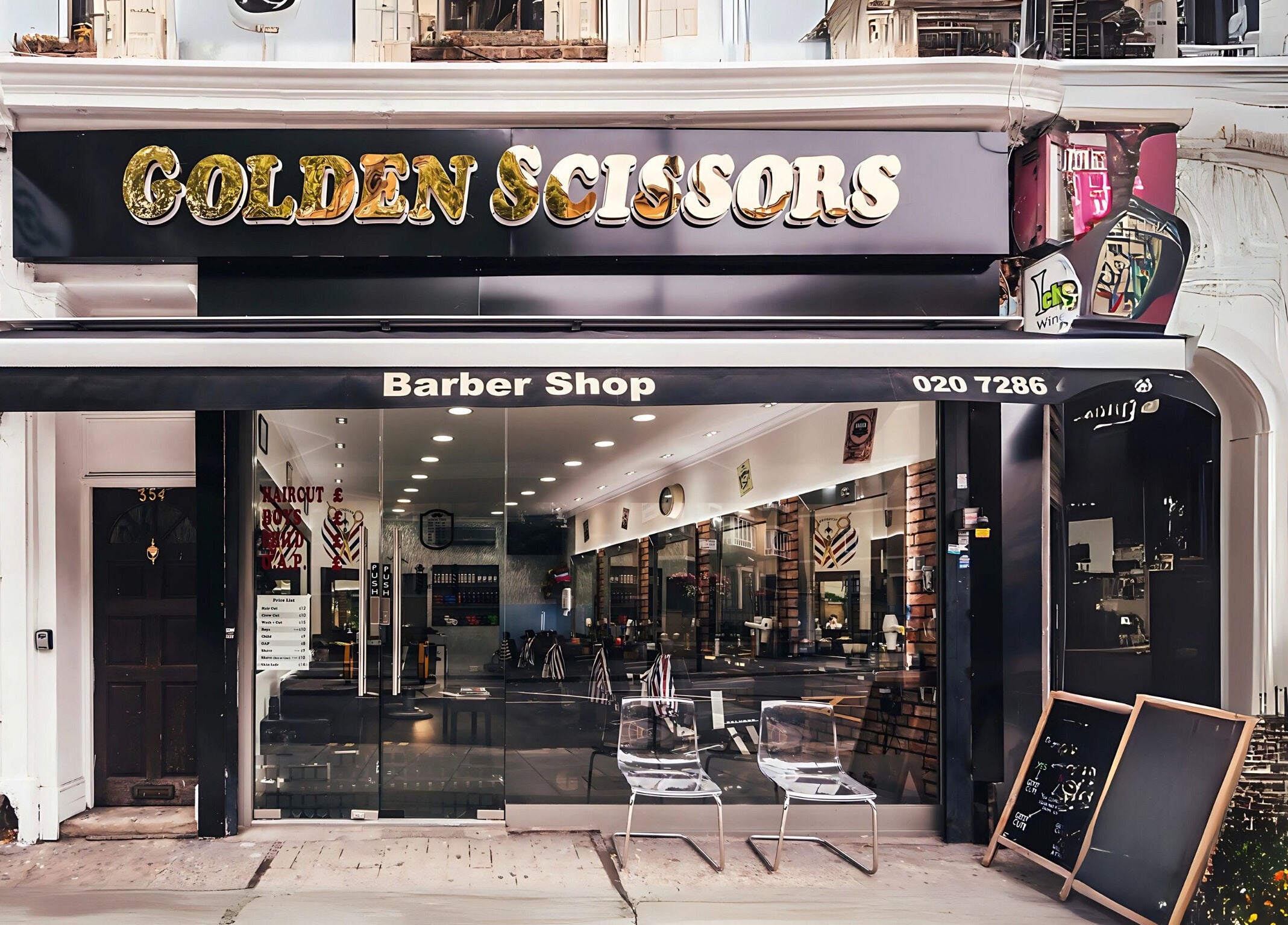Front view of GOLDEN SCISSORS barber shop in London, England, GB with elegant signage and glass facade.