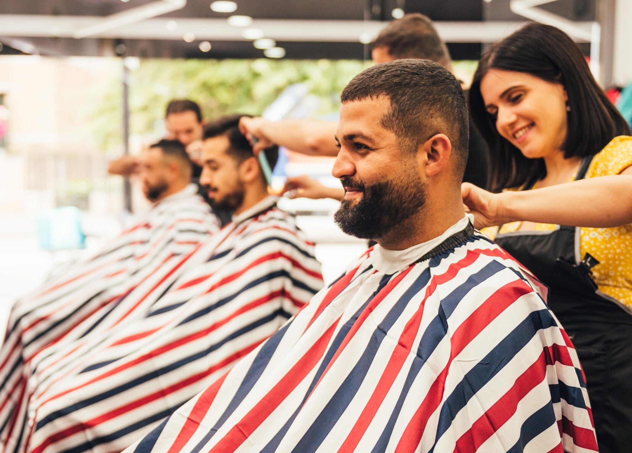 Professional haircuts at GOLDEN SCISSORS, a top barbershop in London, England, GB. Clients enjoy quality grooming.