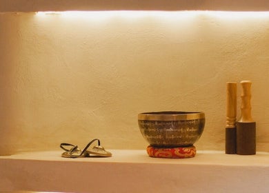 Meditative tools at Aetheria Natural Healing Spa, Canggu, Bali, ID, featuring a singing bowl and mallets.
