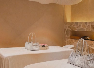 Massage tables with woven bags at Aetheria Natural Healing Spa, Canggu, Bali, ID.