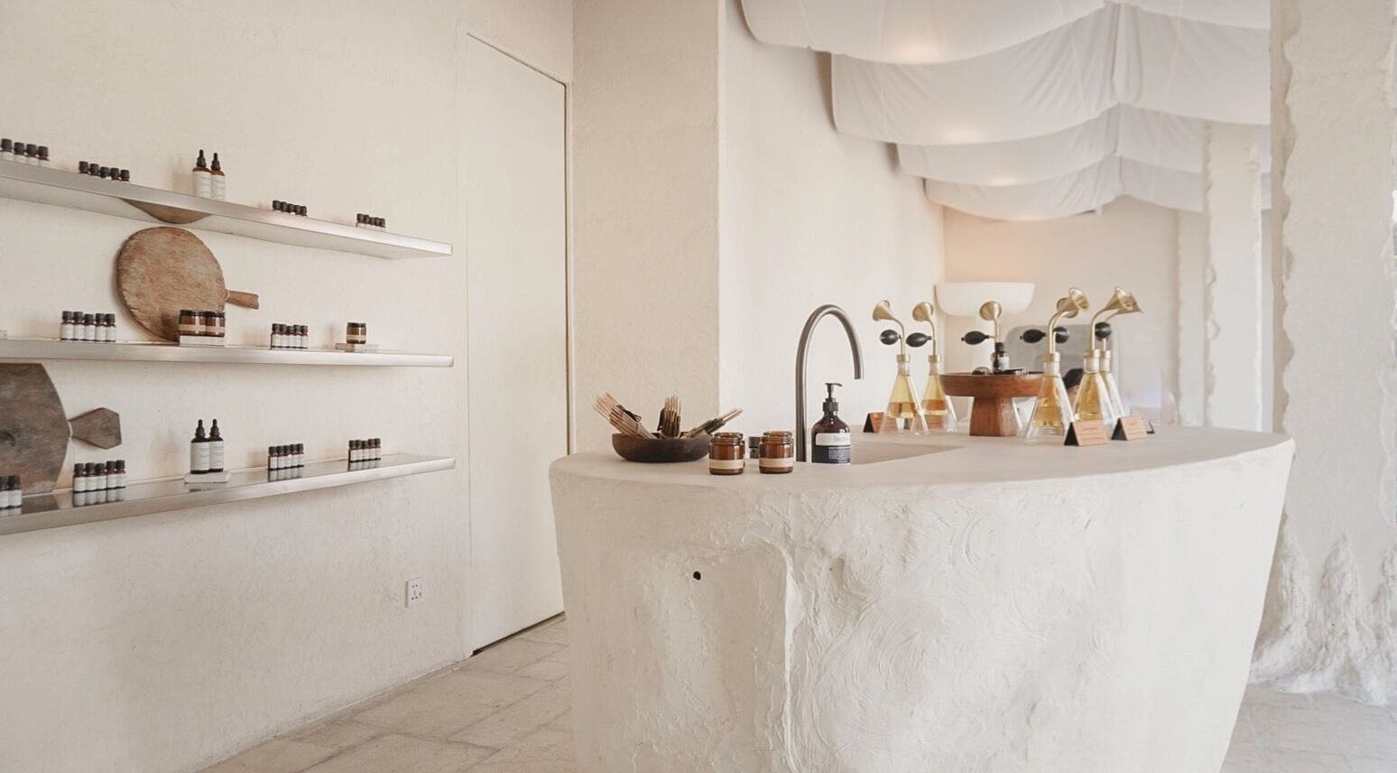 Interior of Aetheria Natural Healing Spa in Canggu, Bali, ID, showcasing natural decor and wellness products.