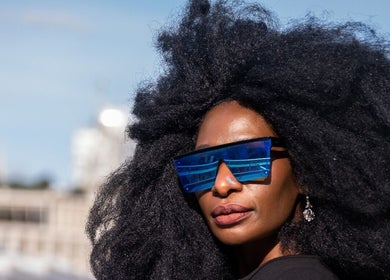 Person in vibrant sunglasses at Zulu Bonita, London, England, GB. Fashionable and trendy look.