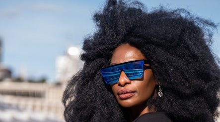 Person in vibrant sunglasses at Zulu Bonita, London, England, GB. Fashionable and trendy look.
