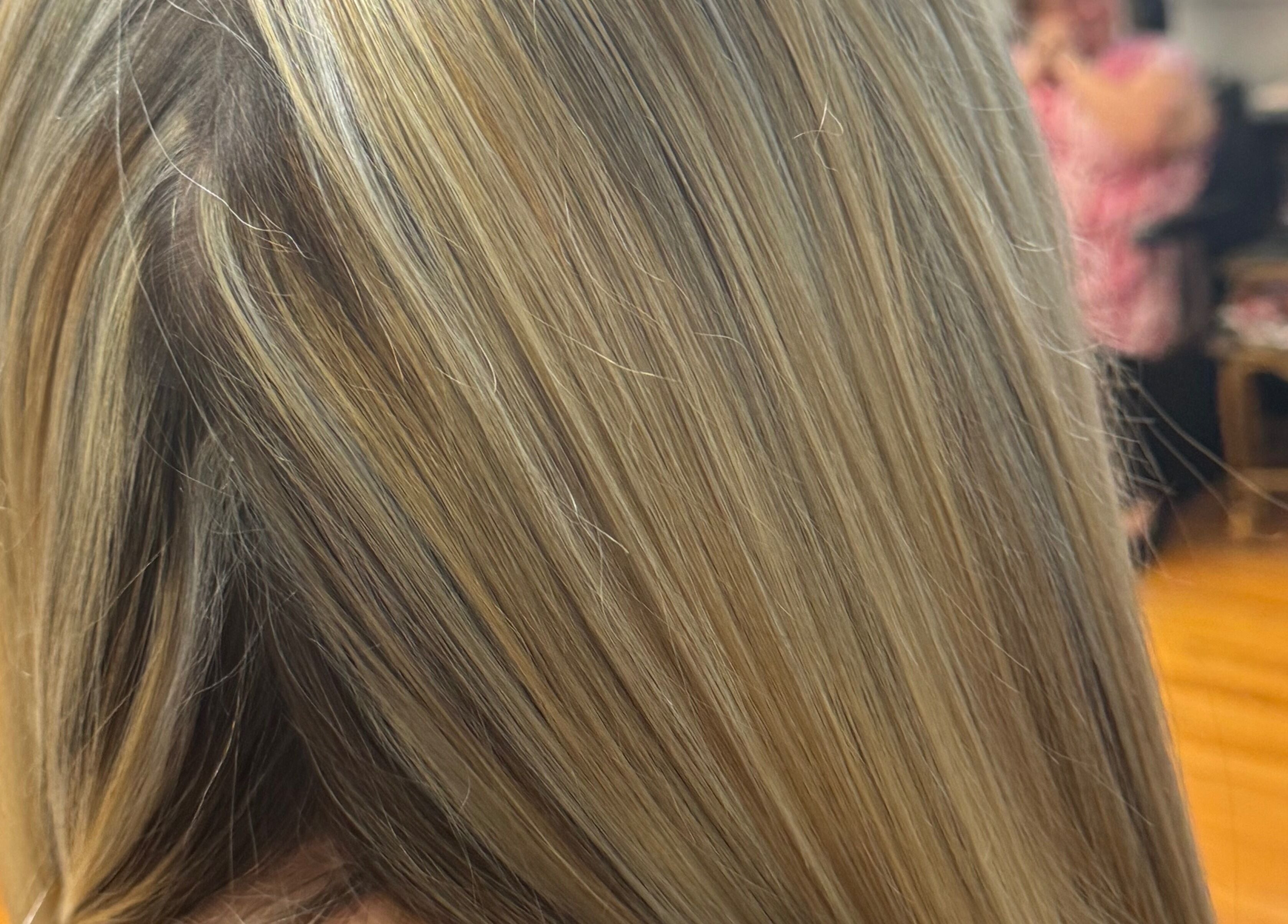 Blonde hair with golden highlights at Styles by Kyle Mobile, Nashville, Tennessee, US.