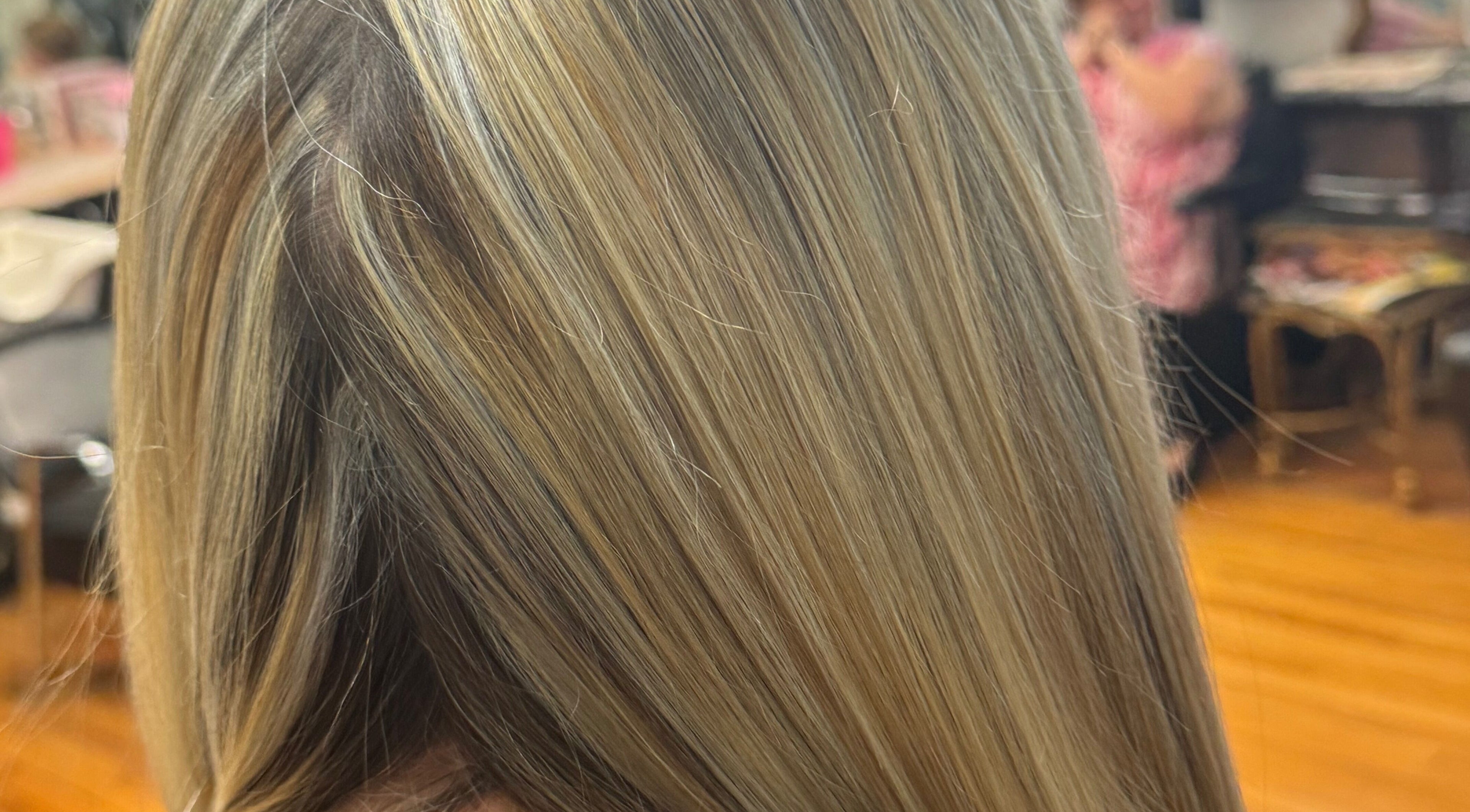 Blonde hair with golden highlights at Styles by Kyle Mobile, Nashville, Tennessee, US.