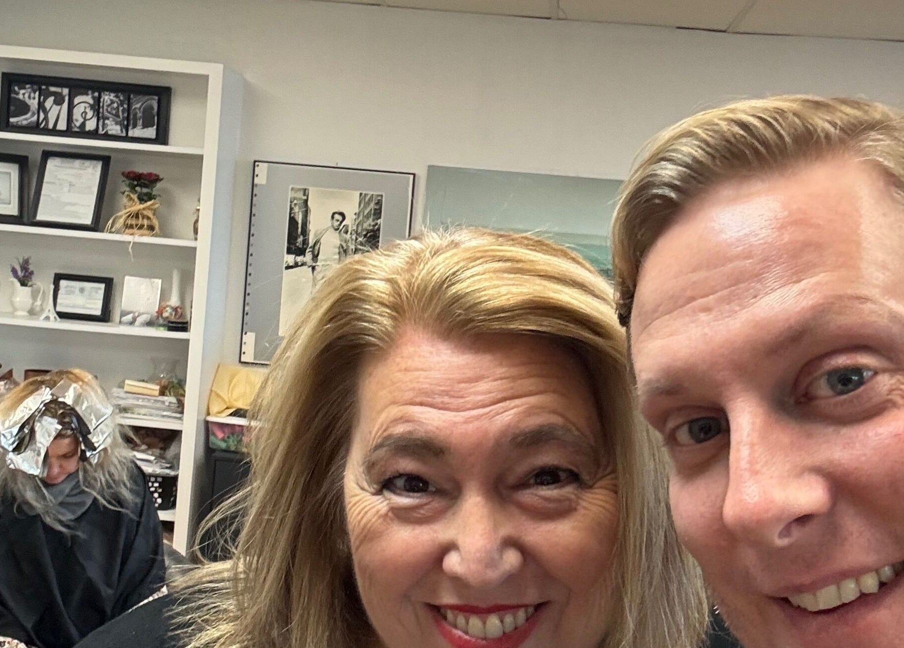 Clients smiling at Styles by Kyle Mobile, Nashville, Tennessee, US with another undergoing treatment in the background.