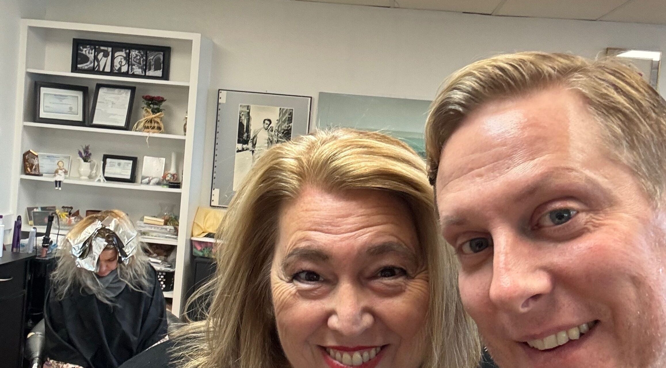 Clients smiling at Styles by Kyle Mobile, Nashville, Tennessee, US with another undergoing treatment in the background.