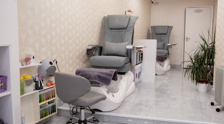Elegant pedicure chairs at Kingscross Nails, London, England, GB. Modern spa setting enhancing relaxation.