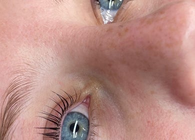 Close-up of blue eyes showcasing lash beauty at Honey Glow Beauty, Port Macquarie, New South Wales, AU.