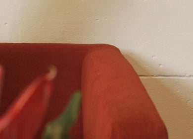 Red couch and vibrant decor at Sculptura: Anti-Cellulite & Body Sculpting, Bali, Bali, ID.